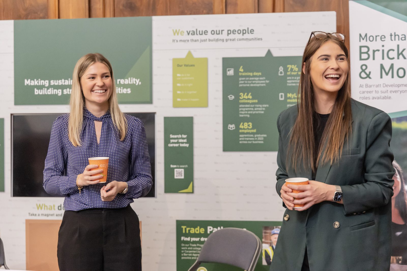 two women representing Get Inspired Southampton and New Forest , giving a speech